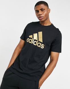 adidas t-shirt in black with gold logo