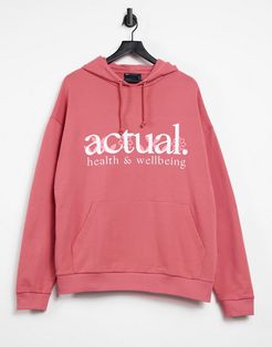 oversized hoodie in pink with wellness text print
