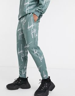 matching slim sweatpants with all-over logo print-Blues