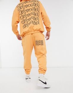 ASOS Daysocial oversized sweatpants set in orange