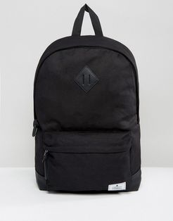 backpack in black canvas with faux leather base and branded patch