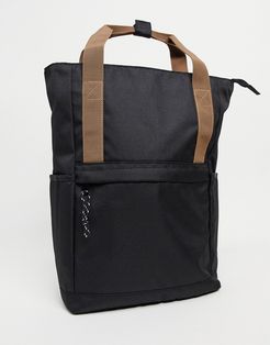 backpack in black with contrast brown grab handles