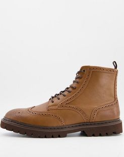 brogue boots in tan faux leather on brown sole