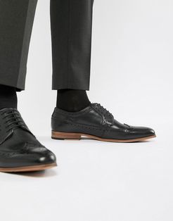 brogue shoes in black leather with natural sole