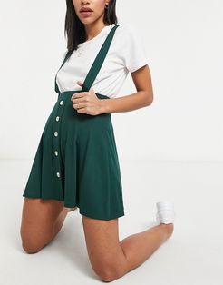 button front mini pinafore skirt in forest green
