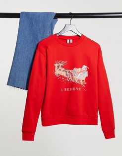 Christmas sweatshirt with I believe print in red
