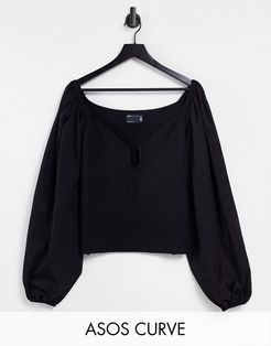 Curve sweater with plunge neck and woven sleeves in black
