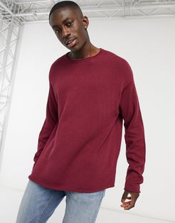 knitted oversized sweater with raw trims in burgundy-Red