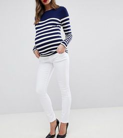 ASOS DESIGN Maternity high rise ridley 'skinny' jeans in optic white with under the bump waistband