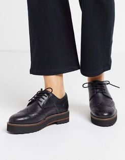 Mottle leather flat brogues in black