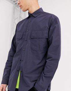 nylon overshirt in navy with angled pockets