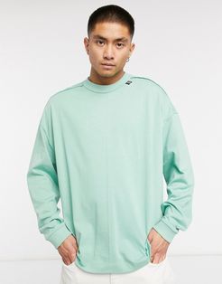 ASOS DESIGN oversized heavyweight long sleeve t-shirt with raw edge detail in green