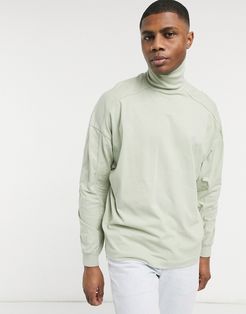 oversized high neck top with seam detail in washed pastel green