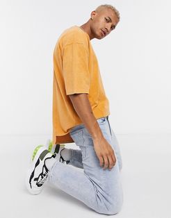 oversized T-shirt with half sleeve in heavyweight yellow acid wash with stepped hem
