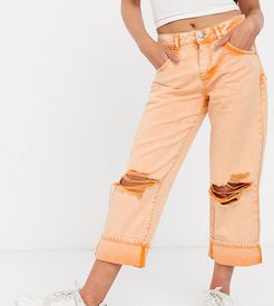 ASOS DESIGN Petite low slung carpenter jeans with extreme rips in orange