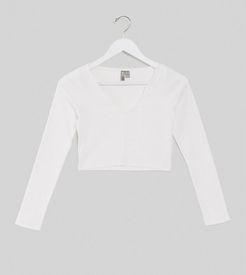 ASOS DESIGN Petite notch front long sleeve crop top in rib in white