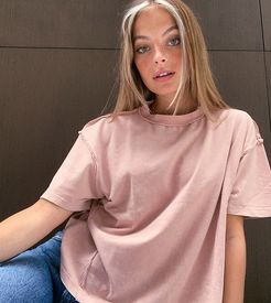 ASOS DESIGN Petite oversized t-shirt with exposed seams in wash in mink-Pink