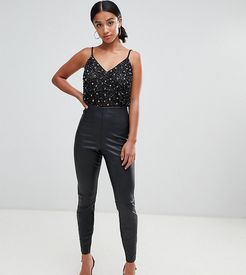 ASOS DESIGN Petite spray on leather look pants-Black