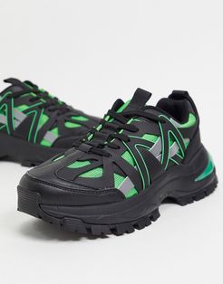 sneakers in green and black with chunky sole