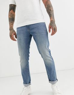 stretch slim jeans in mid wash blue