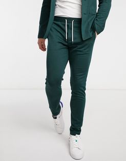 super skinny soft tailored suit pants in jersey in bottle green