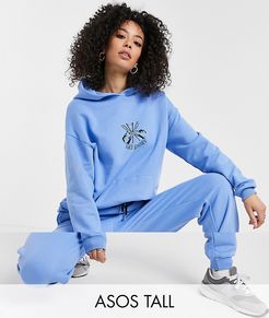 ASOS DESIGN Tall tracksuit oversized hoodie / oversized sweatpants with ski motif in blue-Beige