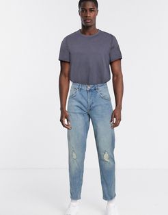 tapered jeans in light wash blue with knee rips-Blues