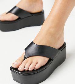Wide Fit Watch toe thong flatforms in black