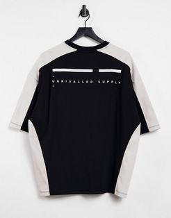 ASOS Unrvlld Spply oversized T-shirt with printed logo in black and white color block