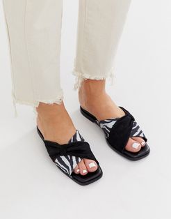 Wallflower leather bow detail flat sandals in black and zebra-Multi