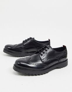 Riddle brogues in black leather
