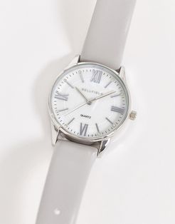 watch with gray strap and silver dial