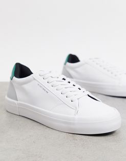 white sneakers with contrast green panel