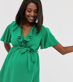 exclusive wrap front tunic with self belt in bright green