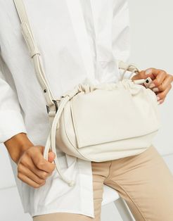 ruched half moon crossbody bag in off-white