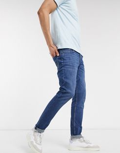 skinny fit jeans in mid wash blue