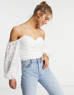 cold shoulder top with puff sleeve and cup detail in textured white