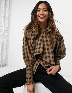 blouse with puff sleeves and bow in brown check