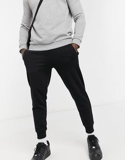 skinny cuffed sweatpants in black with small logo