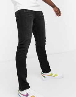 slim tapered jeans in black wash with logo