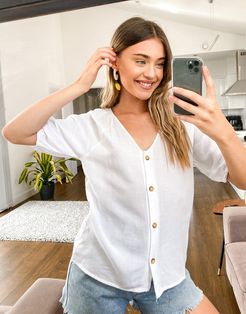 blouse with button through in white