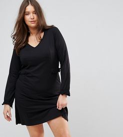 long sleeve jersey mini dress in black with frill detail