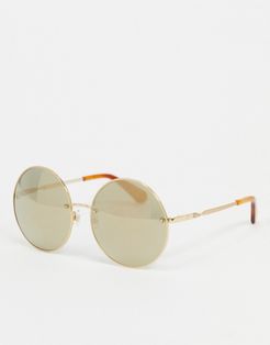round sunglasses in gold with tortoise shell tips