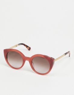 round sunglasses in pink with tortoise shell tips