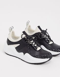 maddox jogger sneakers in black and white leather