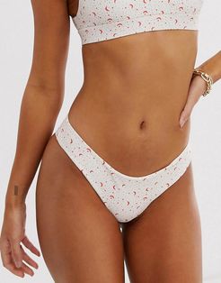 reversible cheeky bikini bottom in cream moon and star print-Multi
