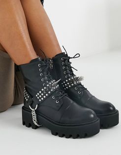 Deviant lace up boots with studded harness in black