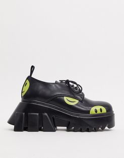 half extreme chunky shoes in black with cheeky face