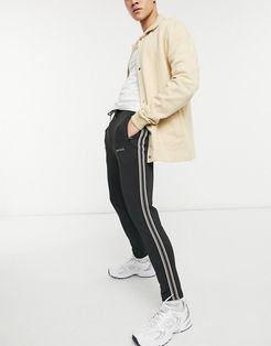 sweatpants in black with contrast piping - part of a set