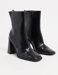 Robbie vegan-friendly leather heeled boot in black